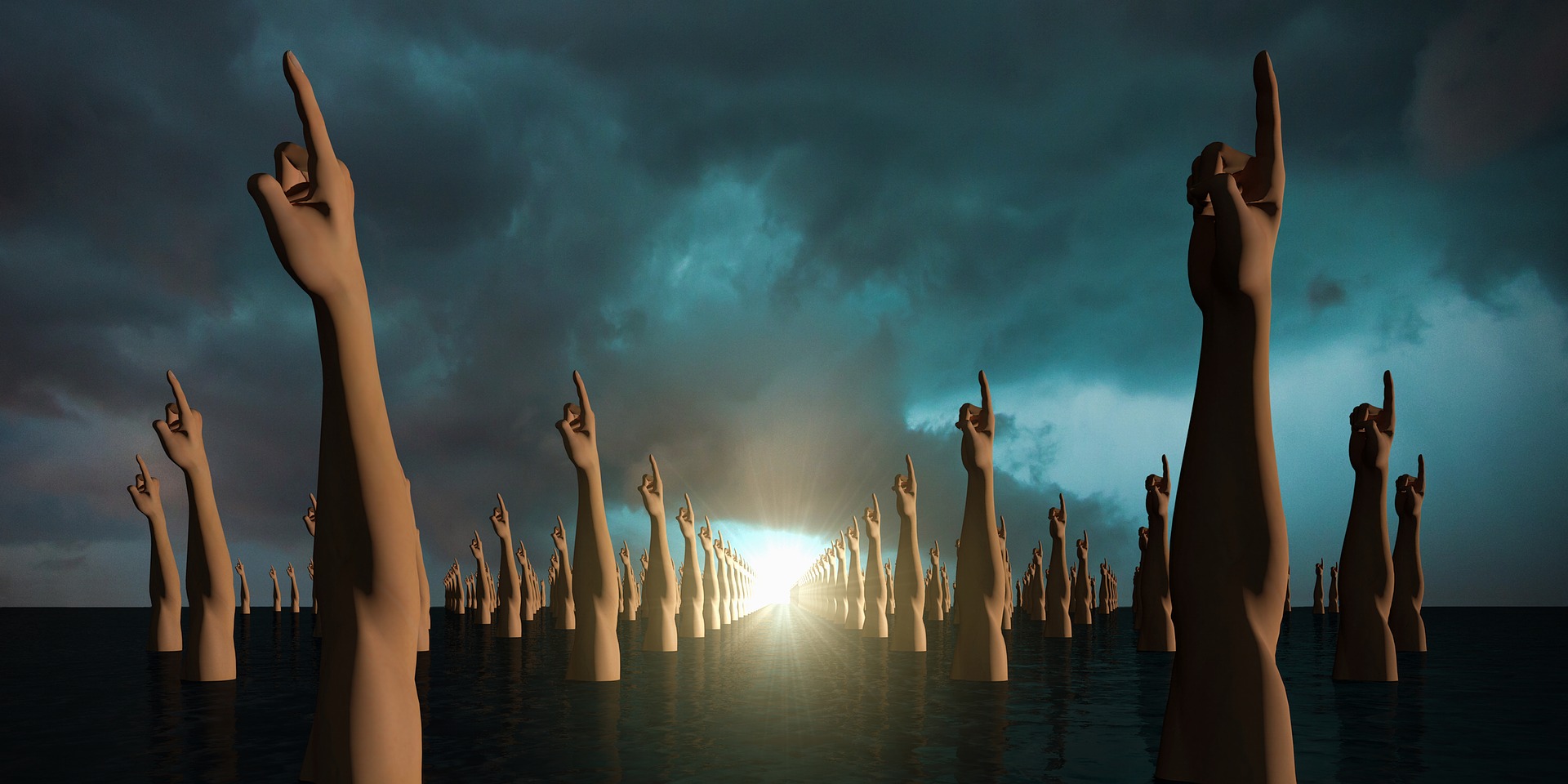 Un monton de esculturas de brazos con el dedo indice extendido sobre una tierra negra bajo un cielo nublado con un destello de luz al fondo